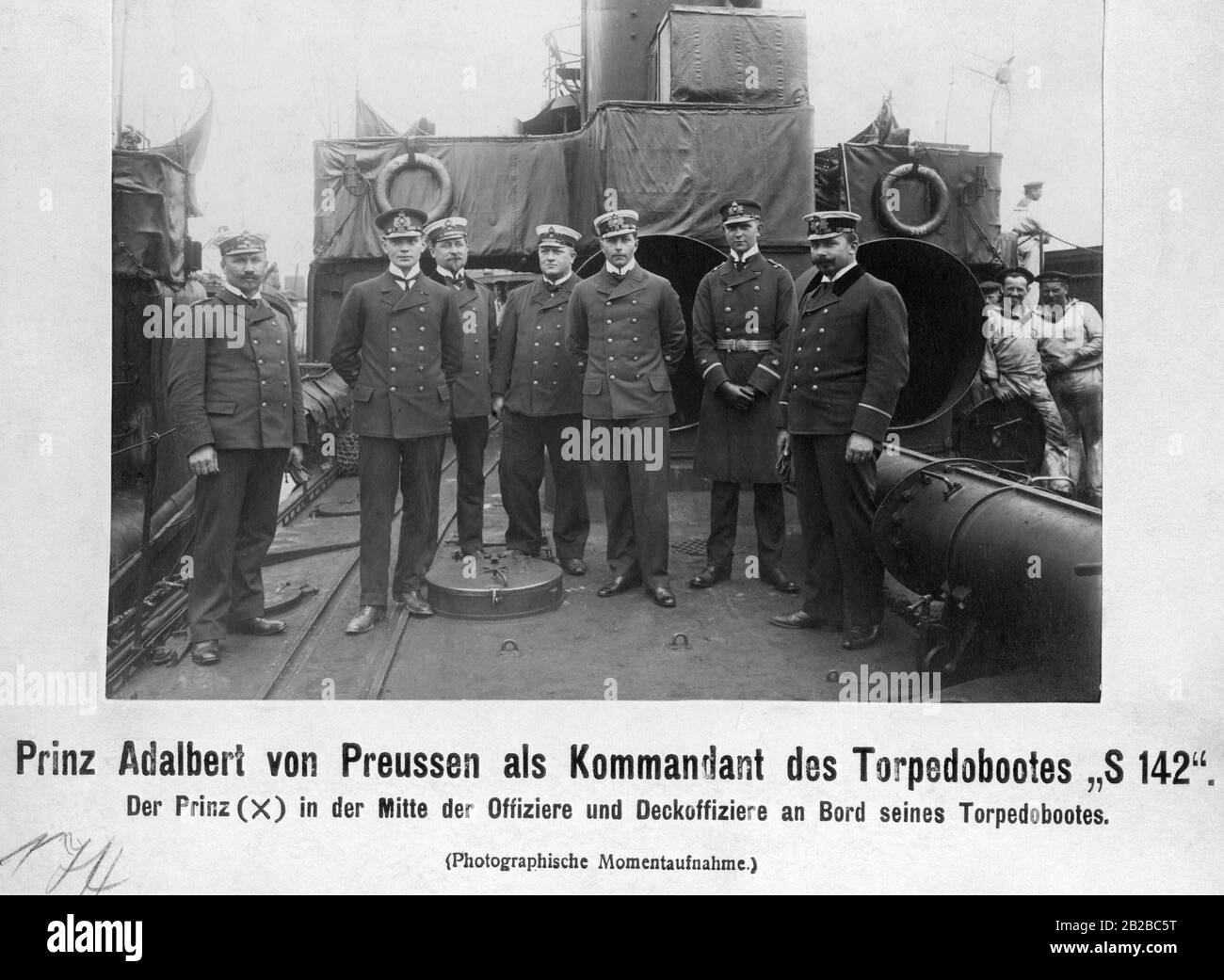 Prince Adalbert of Prussia standing in the middle between officers and deck officers on deck of the German torpedo boat S 142. The ship belongs to the class of the large torpedo boats and was put into service in 1907. Stock Photo