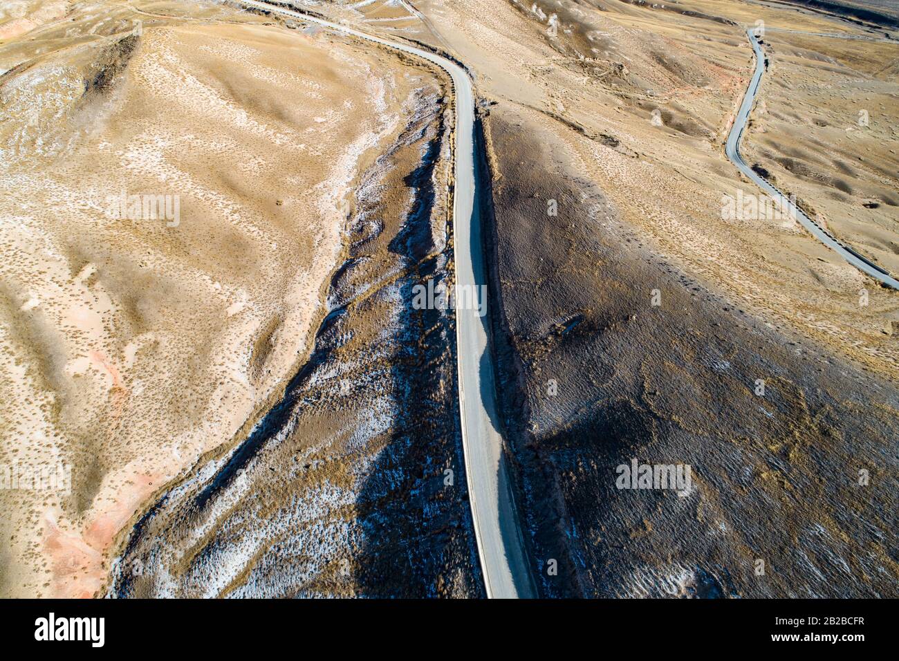 aerial view of the curved Qilian mountain road Stock Photo