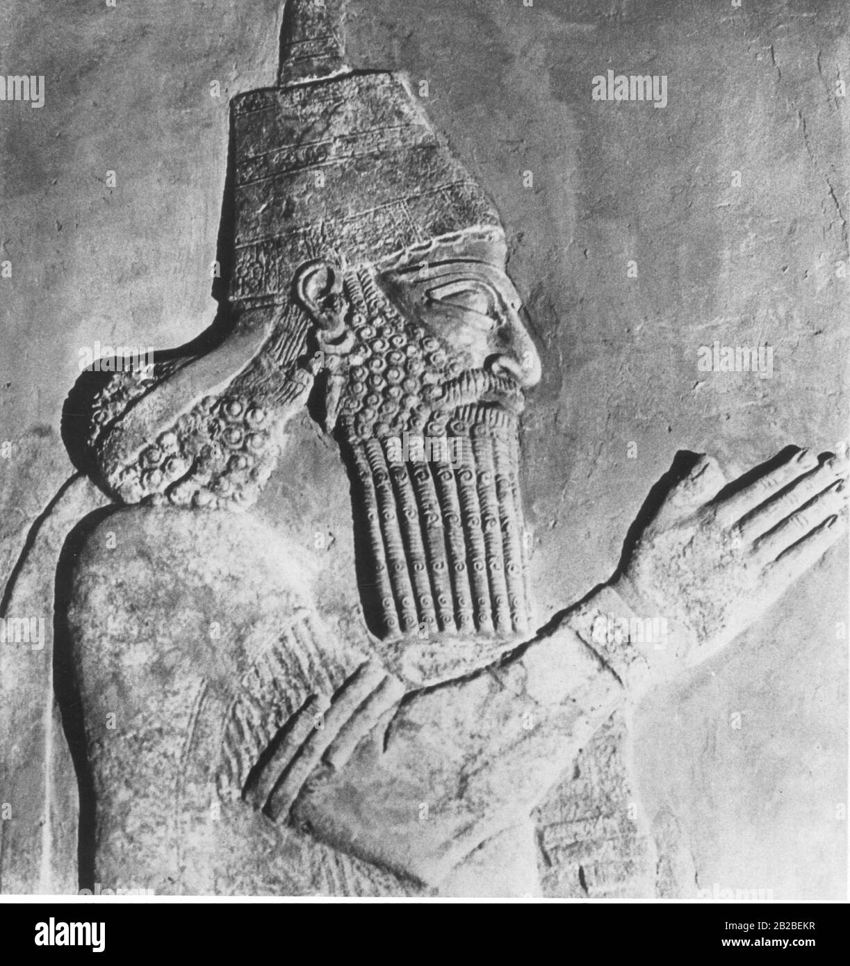 King Sargon II (721 - 705 BC), shown on a typical Assyrian relief from the Royal Palace of Dur-Sharrukin (Khorsabad). The relief is again not a portrait of the king, but a conventional representation of an Assyrian ruler. Stock Photo