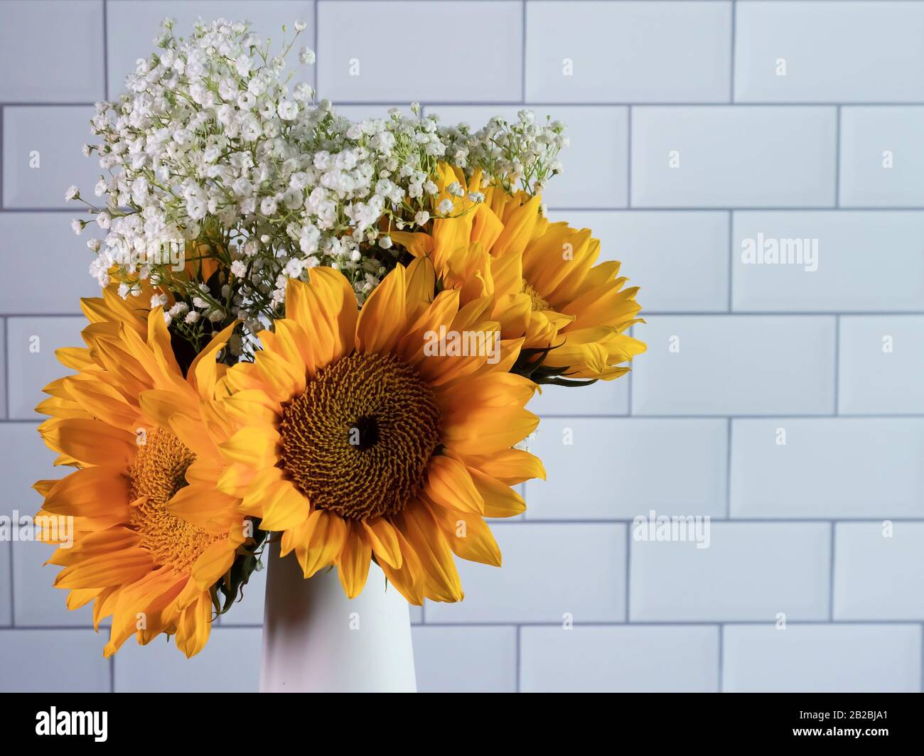 Yellow Sunflower And White Babies Breath Flower Arrangement In A