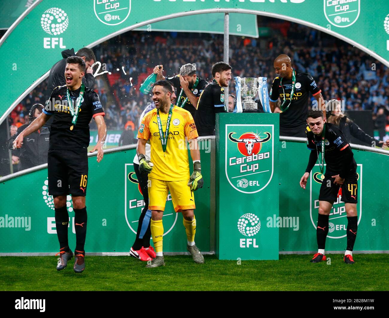 LONDON, UNITED KINGDOM. MARCH 01 L-R Manchester City's Rodrigo Manchester City's Claudio Bravo and Manchester City's Phil Foden with Carabao Cup Troph Stock Photo