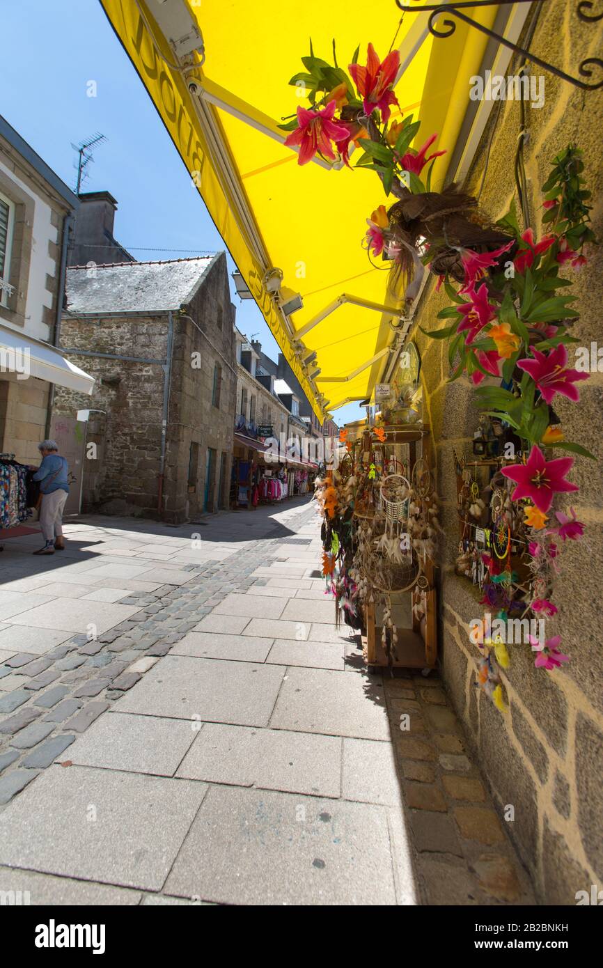 Town of Concarneau, France. Picturesque view of craft and souvenir shops in Concarneau medieval Ville Close, at Rue Vauban. Stock Photo