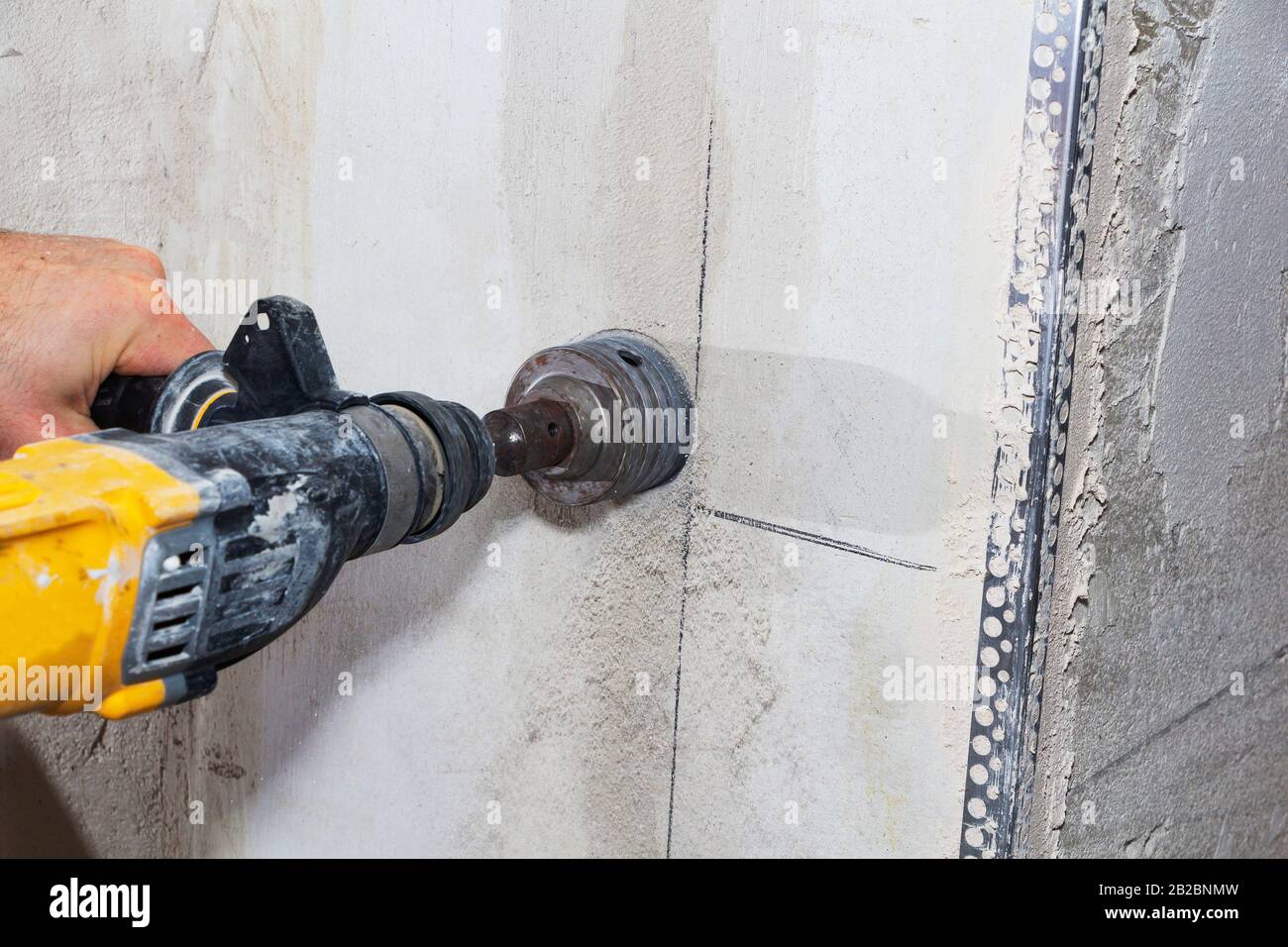 drill hole for electrical outlet outlet, special power tool drill Stock