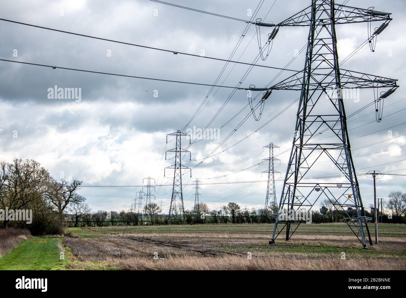 High voltage electricity pylons and power lines background. Industry