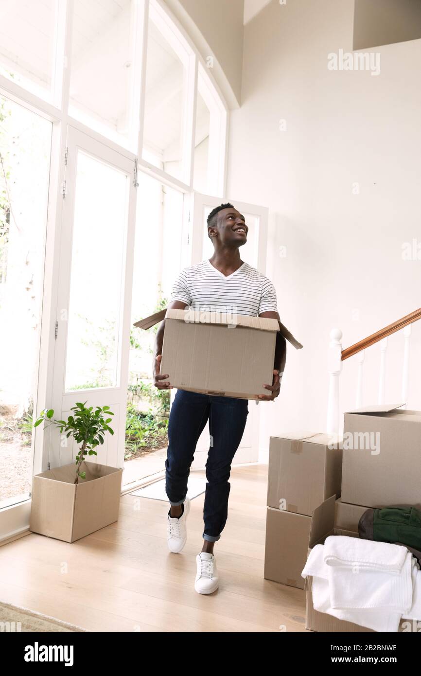 Man moving in to a new home Stock Photo