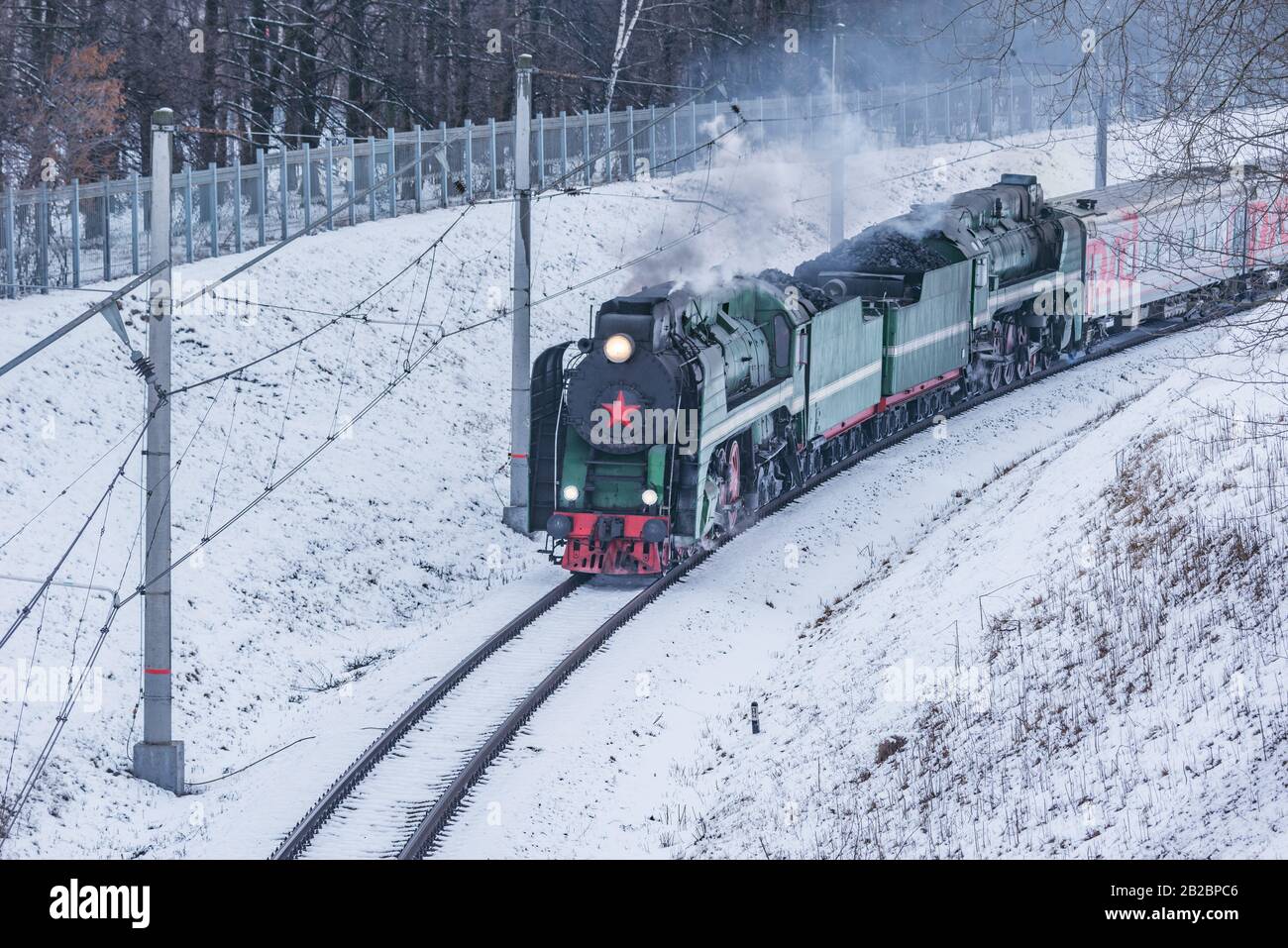 Korolev, Russia - February 23, 2019: Retro train moves at winter day time. Stock Photo