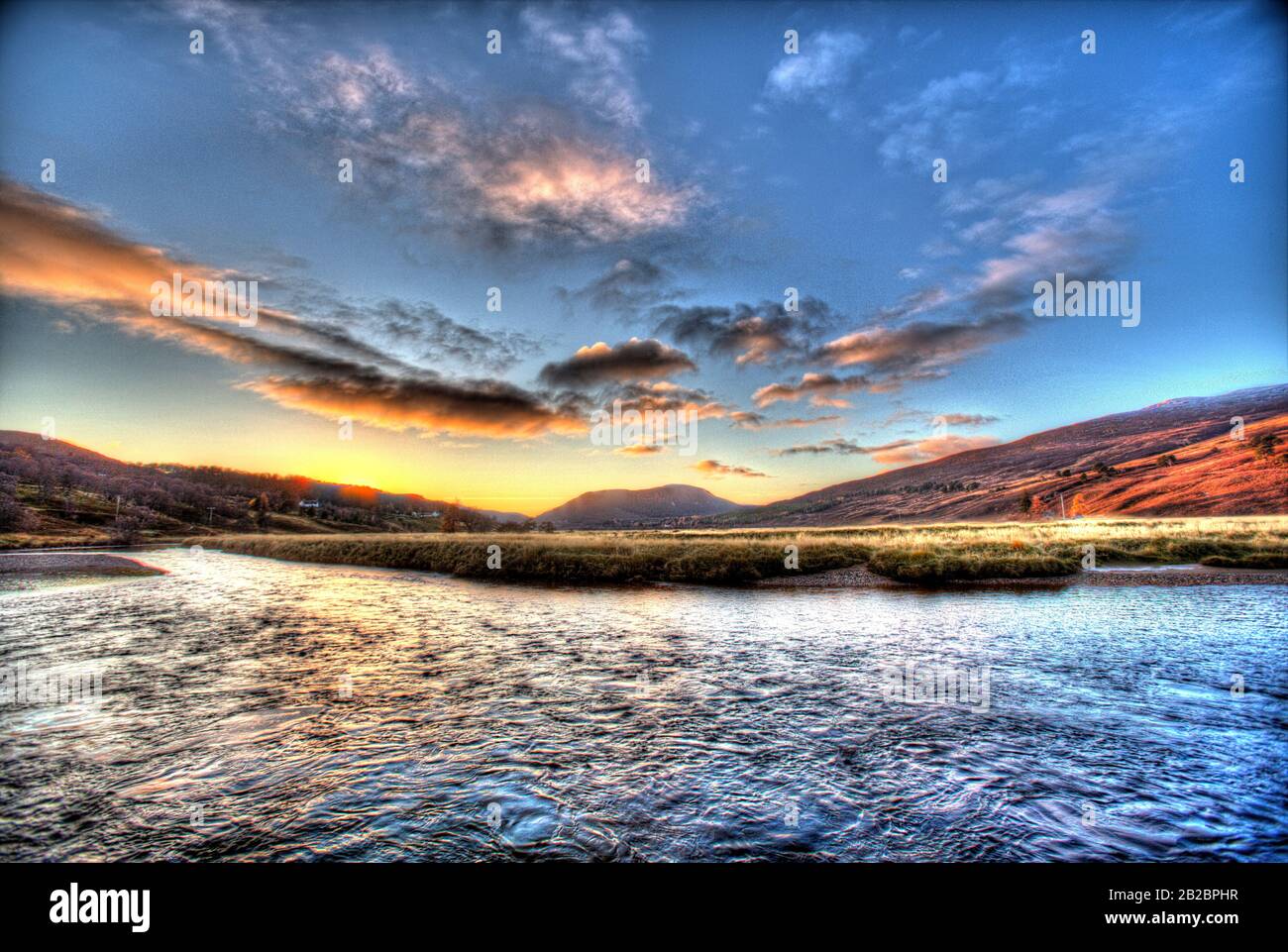 Area of Braemar, Scotland. Artistic sunset view over the River Dee, on the outskirts of Breamar. Stock Photo