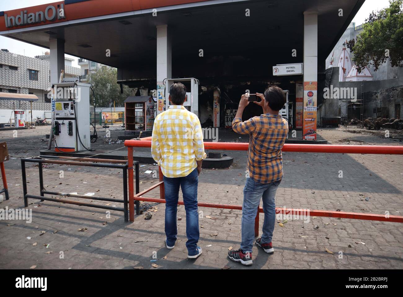 February 29, 2020: Scene of charred petrol pump after it was set on fire by  a mob during riots in Chandbagh area of New Delhi, India on 29 February  2020. More than