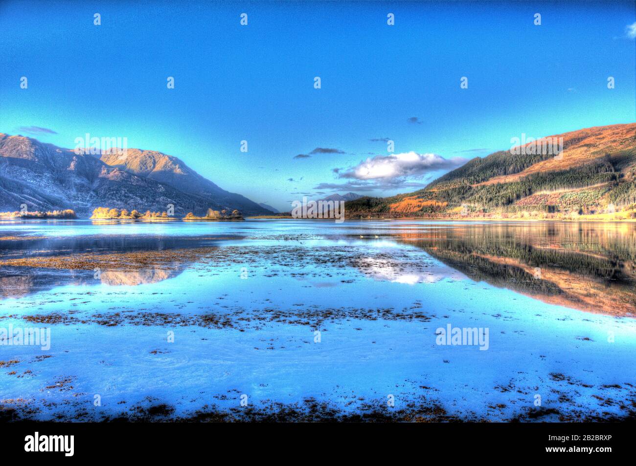 Area of Glencoe, Scotland. Artistic morning view of Loch Leven looking west towards North Ballachulish from the shores of Invercoe. Stock Photo
