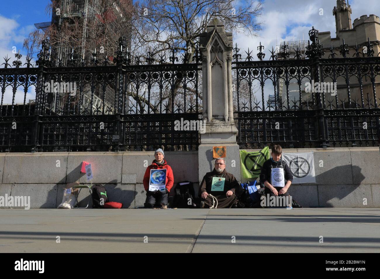 Westminster, London, UK. 2nd Mar, 2020. Extinction Rebellion (XR) have staged a meditation sit-down protest outside the gates to the House of Commons as part of their '40 Day Prayer and Meditation Vigil'. Christian Climate Action and Extinction Rebellion Faith Communities have joined forces during Lent for 40 days of Action for the planet. Credit: Imageplotter/Alamy Live News Stock Photo