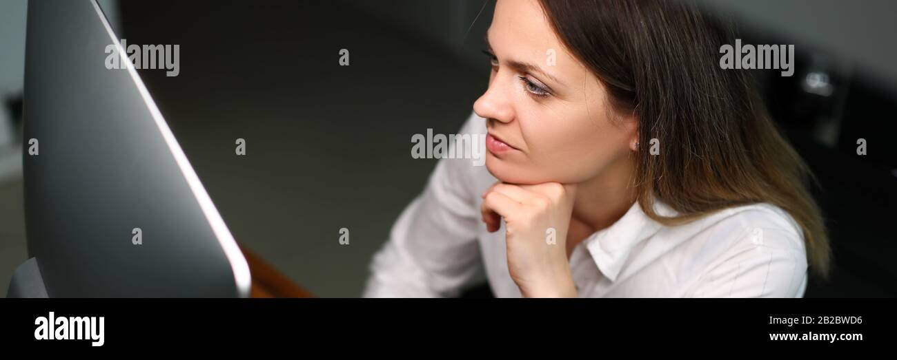 Concentrated woman at workspace Stock Photo