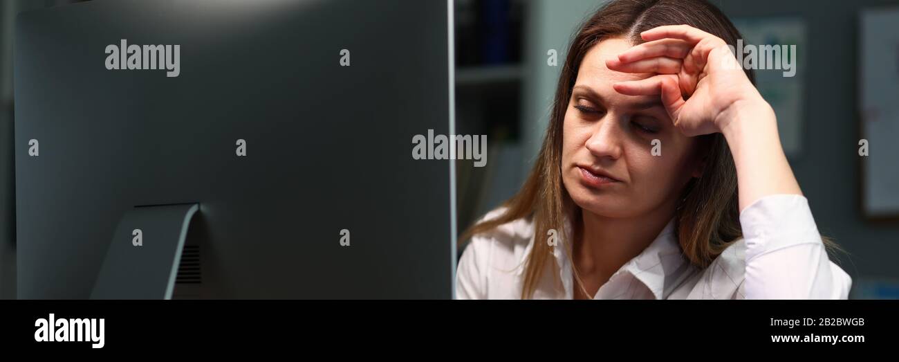 Woman tired checking documents, closed her eyes Stock Photo