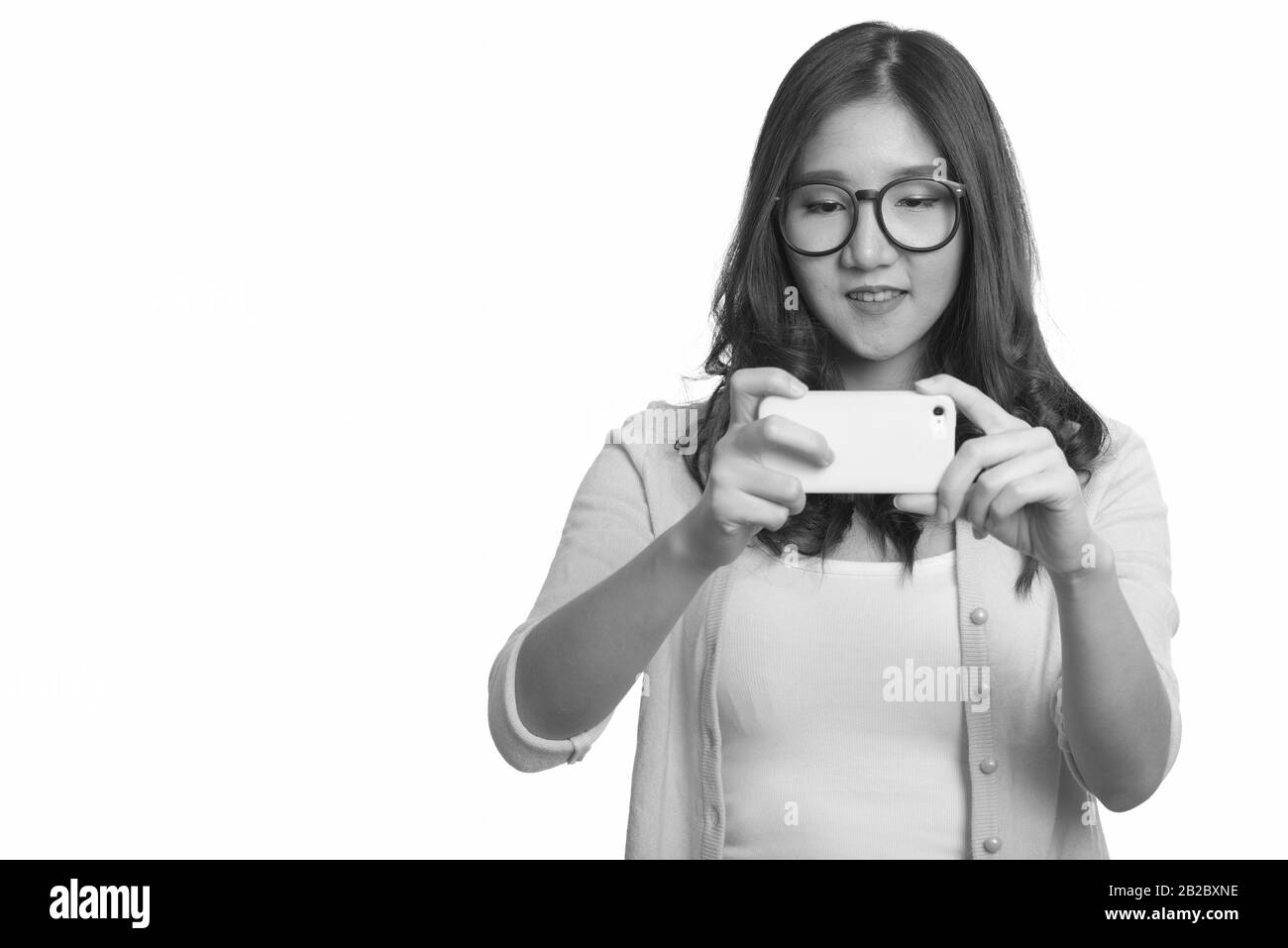 Portrait of young beautiful Asian woman in black and white Stock Photo ...