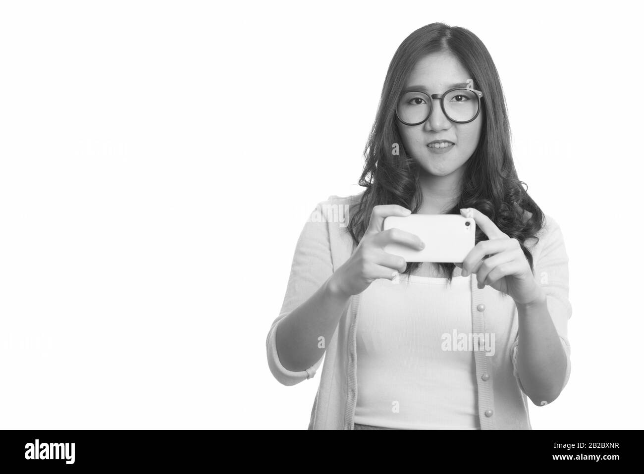 Portrait of young beautiful Asian woman in black and white Stock Photo ...