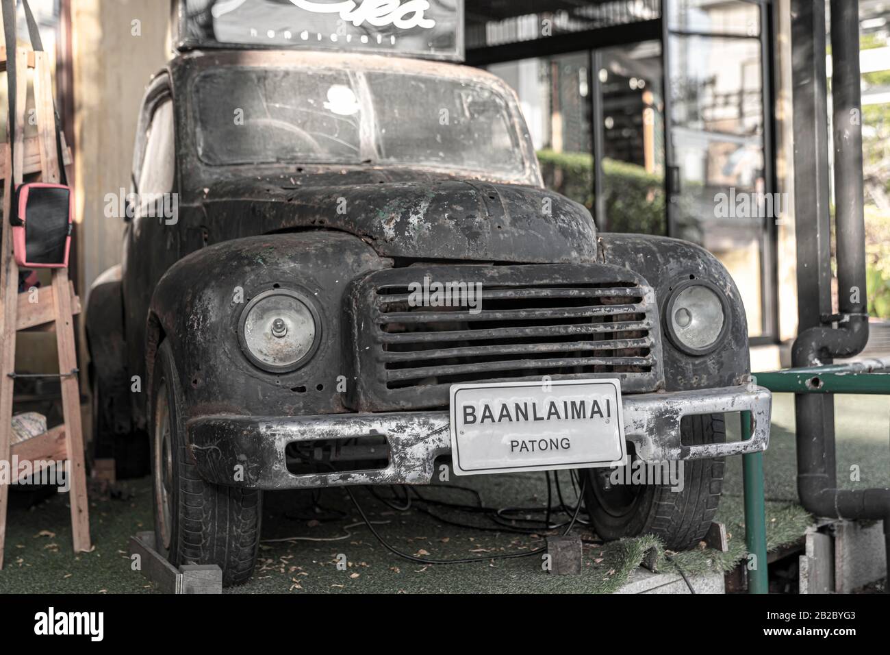 Patong, Phuket Thailand, January 5, 2020: Patong, Phuket Thailand, January 5, 2020: old rusty pickup truck used in cafes for advertising as part of th Stock Photo