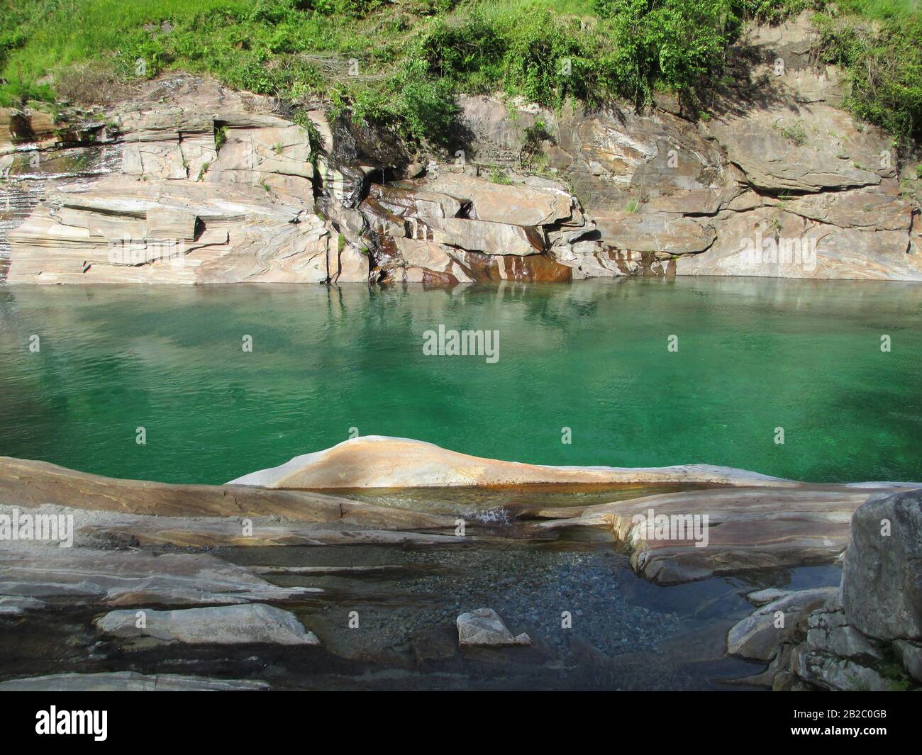 Emerald mountain water and rocks in Switzerland Stock Photo Alamy