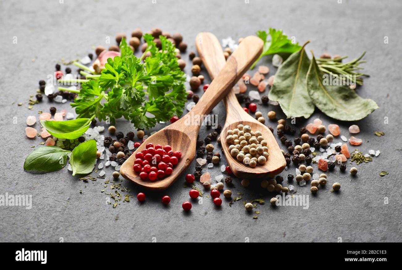 Spices and herbs on a black board Stock Photo