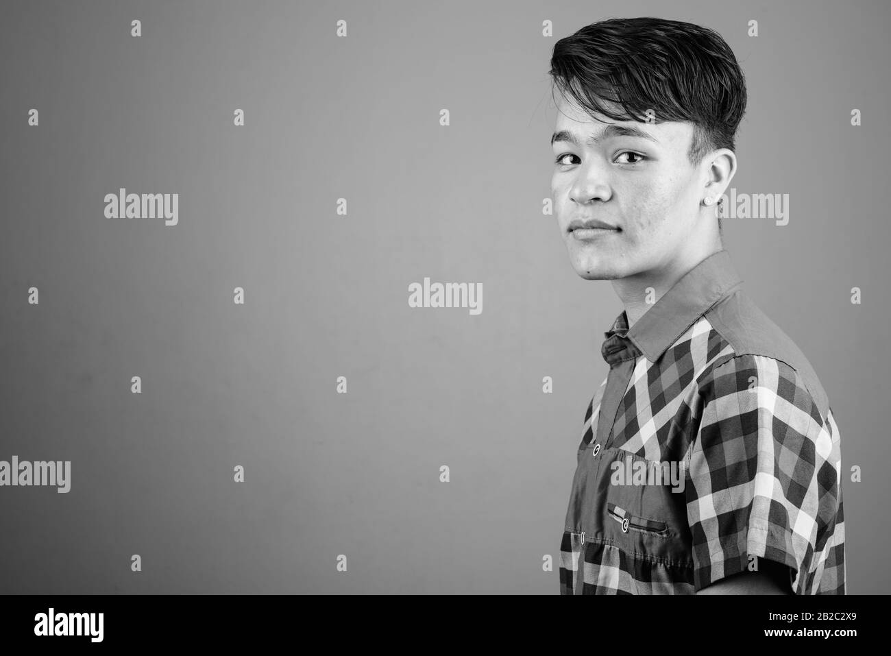 Portrait of young handsome Asian teenage boy Stock Photo