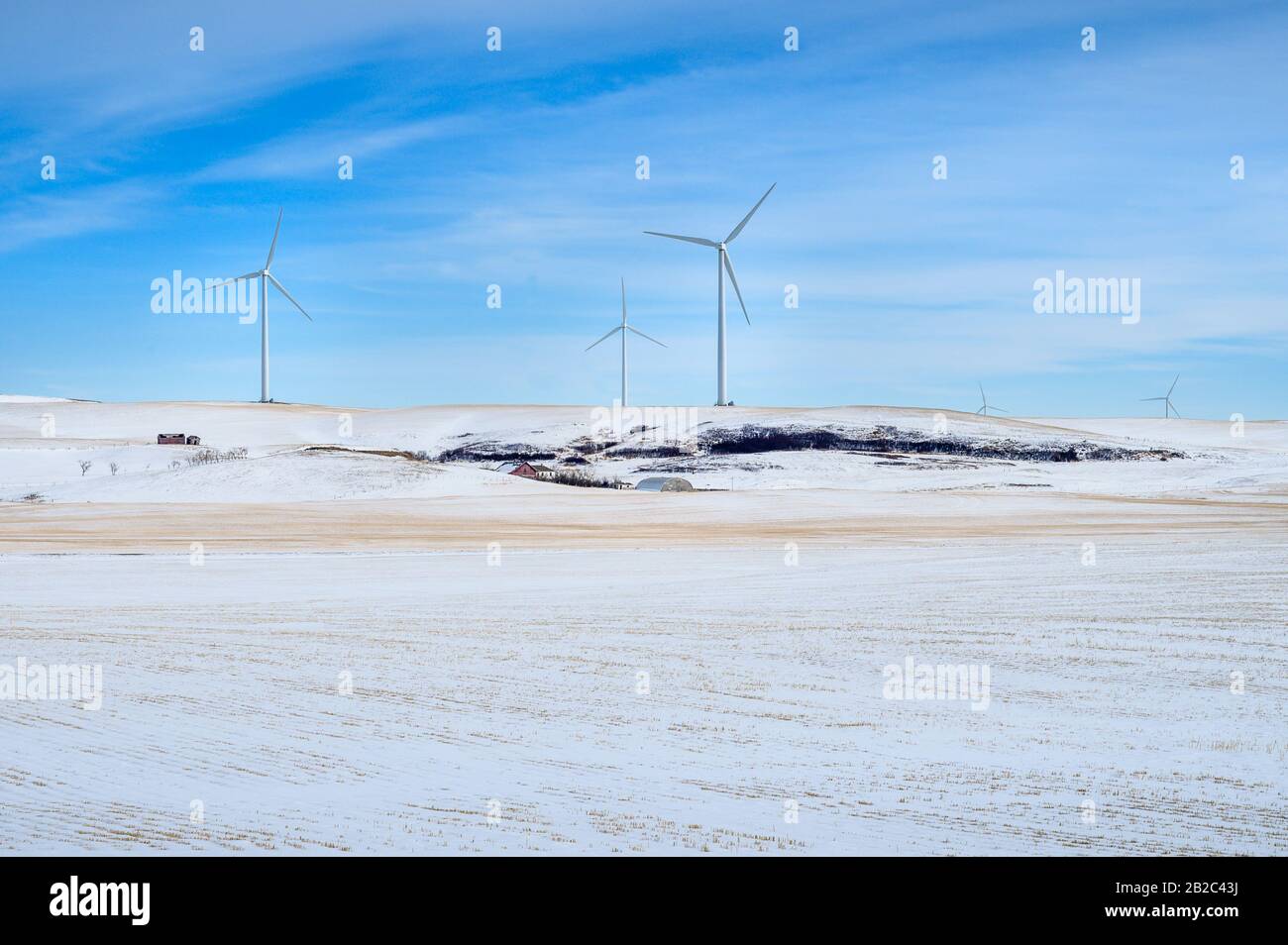 Winter view of wind turbines in an agricultural field near the town of Rosebud, Alberta, Canada Stock Photo