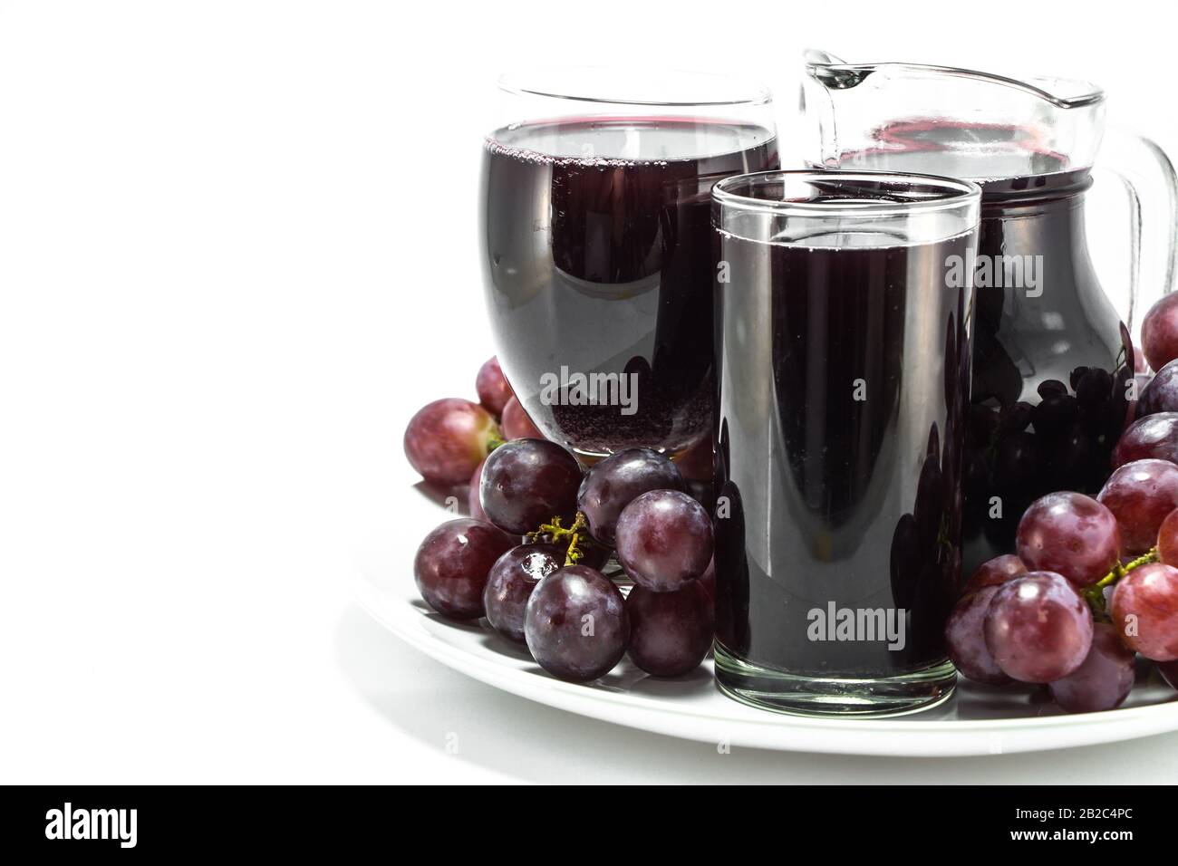 Red grapes and a glass of red wine Stock Photo Alamy