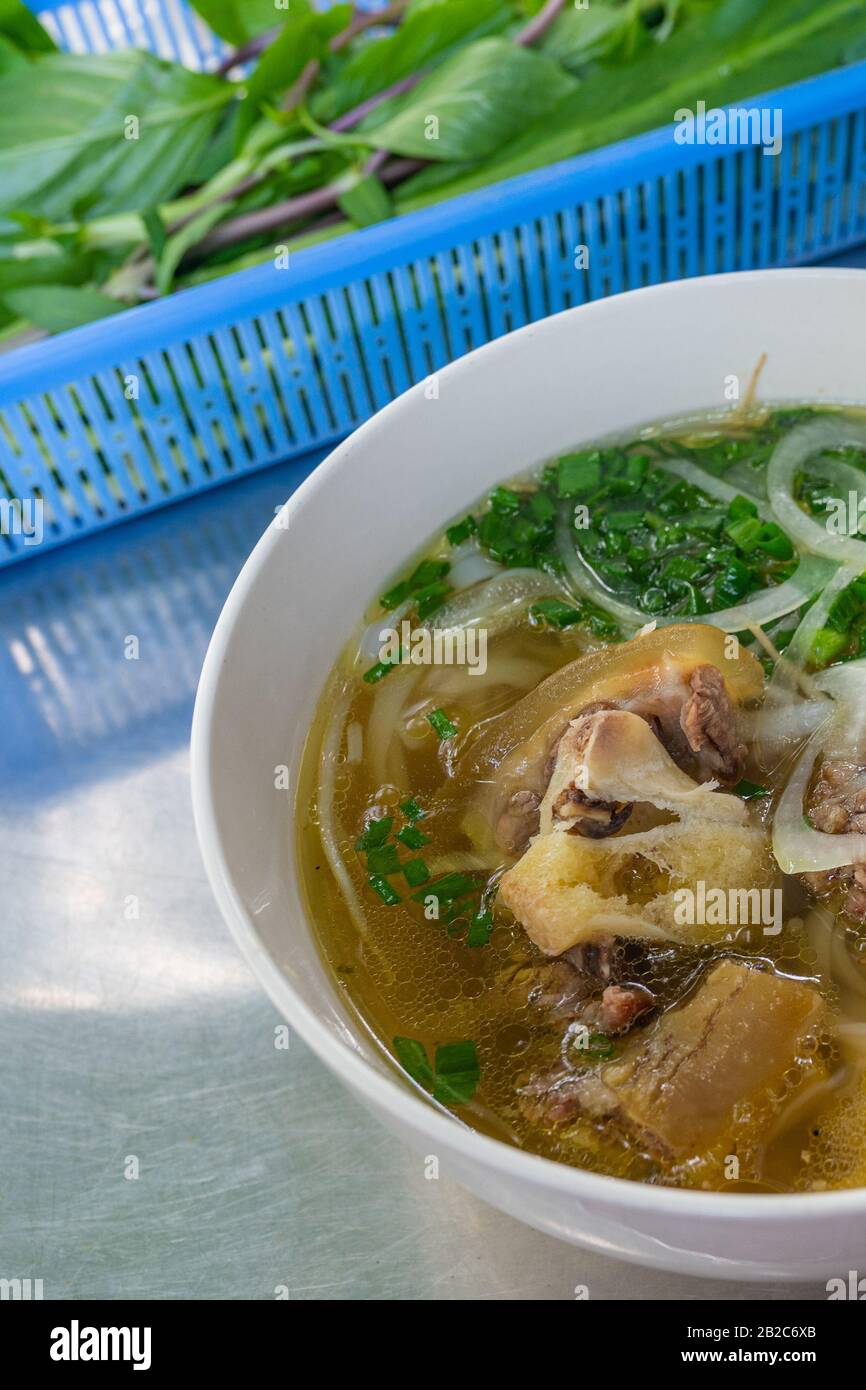 Famous Vietnamese cuisine - Pho beef noodle served with vegetable Stock
