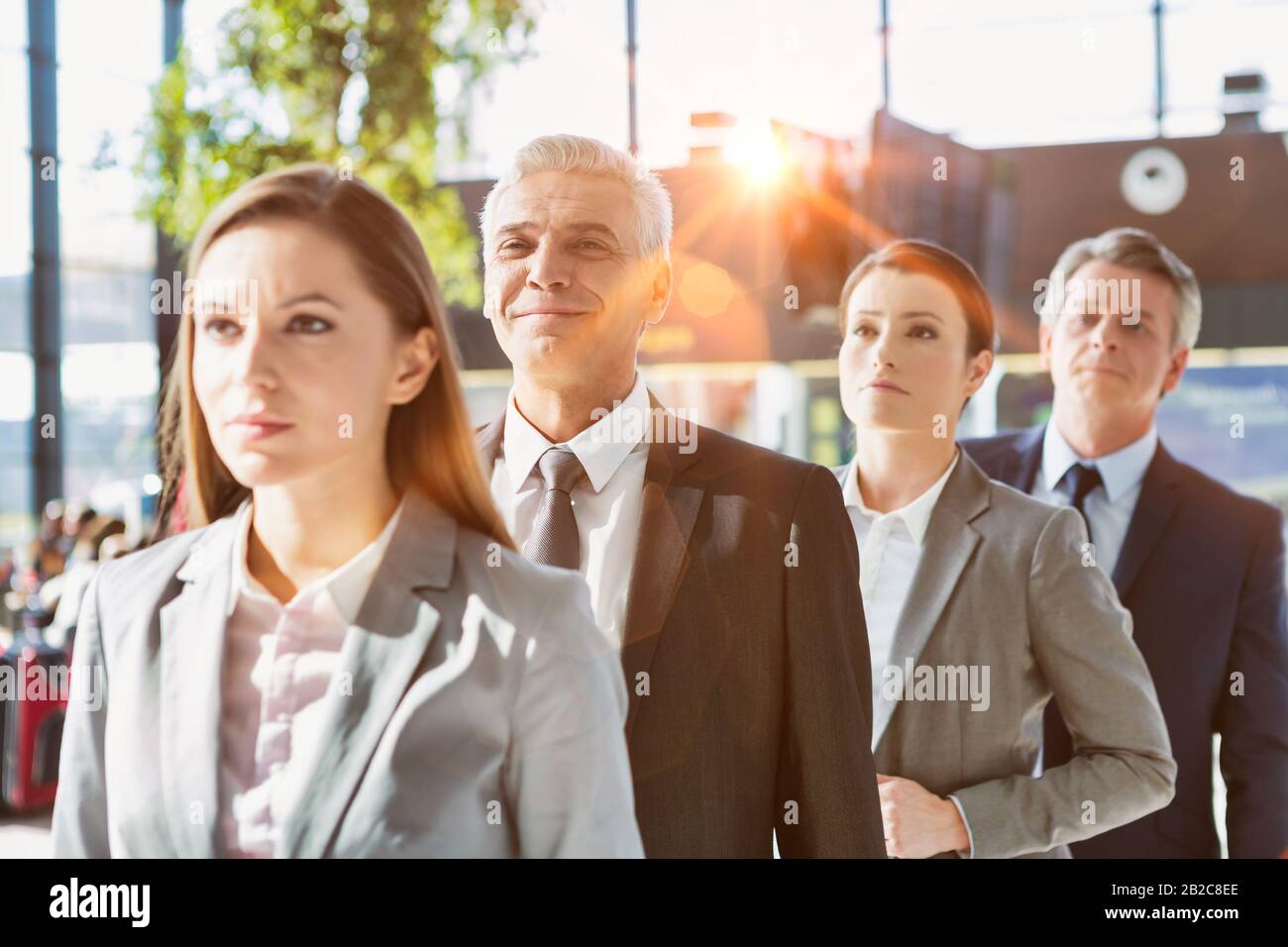 Business people queueing for check in airport Stock Photo - Alamy