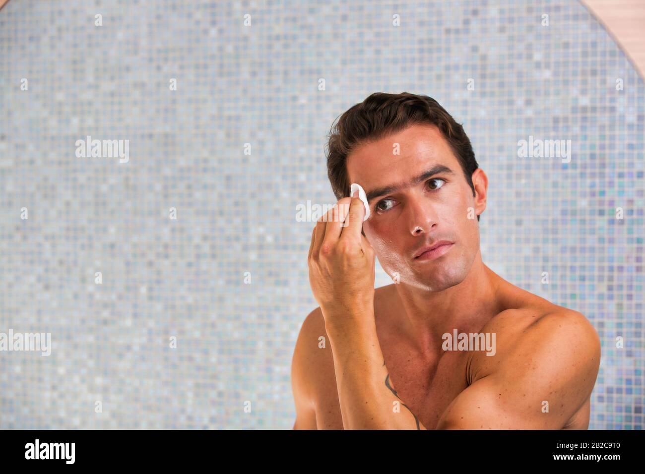 Attractive man performing skin care before bed Stock Photo Alamy