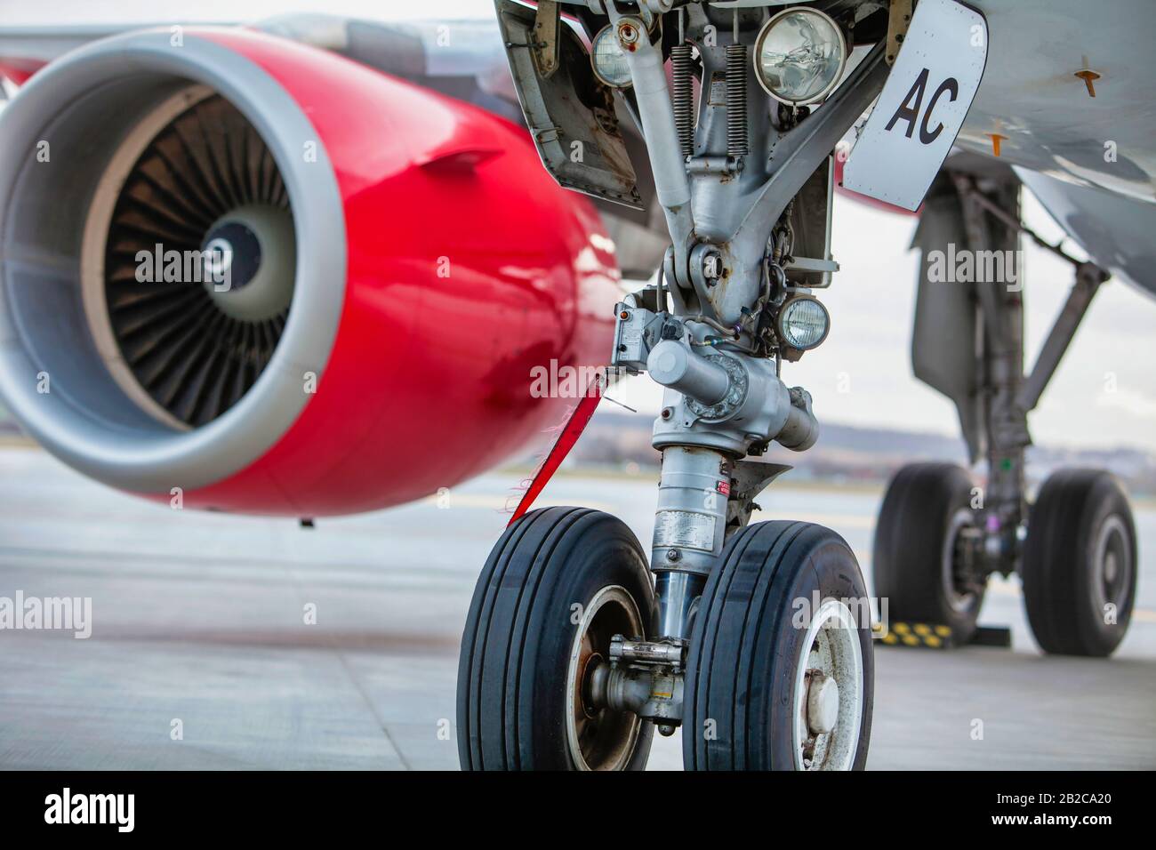 Close up of airplane engine in airport Stock Photo - Alamy