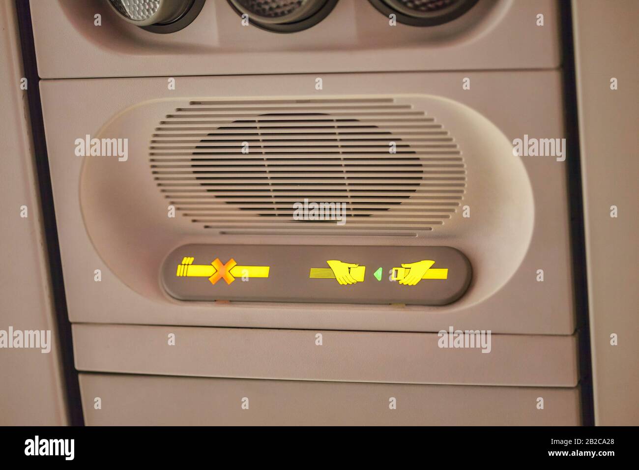 Close up of Airplane seat belt sign on Stock Photo Alamy