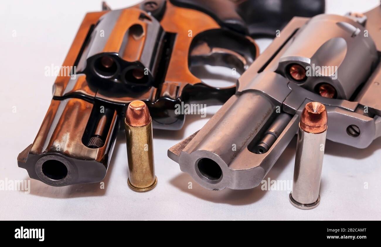 Two Snub Nose Revolvers A Black 38 Special And A Stainless Steel 357 Magnum Each With A Bullet For It In Front Of It On A White Background Stock Photo Alamy Two Snub Nose Revolvers A Black 38 Special And A Stainless Steel 357 Magnum Each With A Bullet For It In Front Of It On A White Background Stock Photo Alamy
