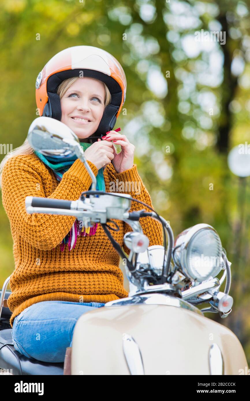 Woman posing on motorbike hi-res stock photography and images - Alamy