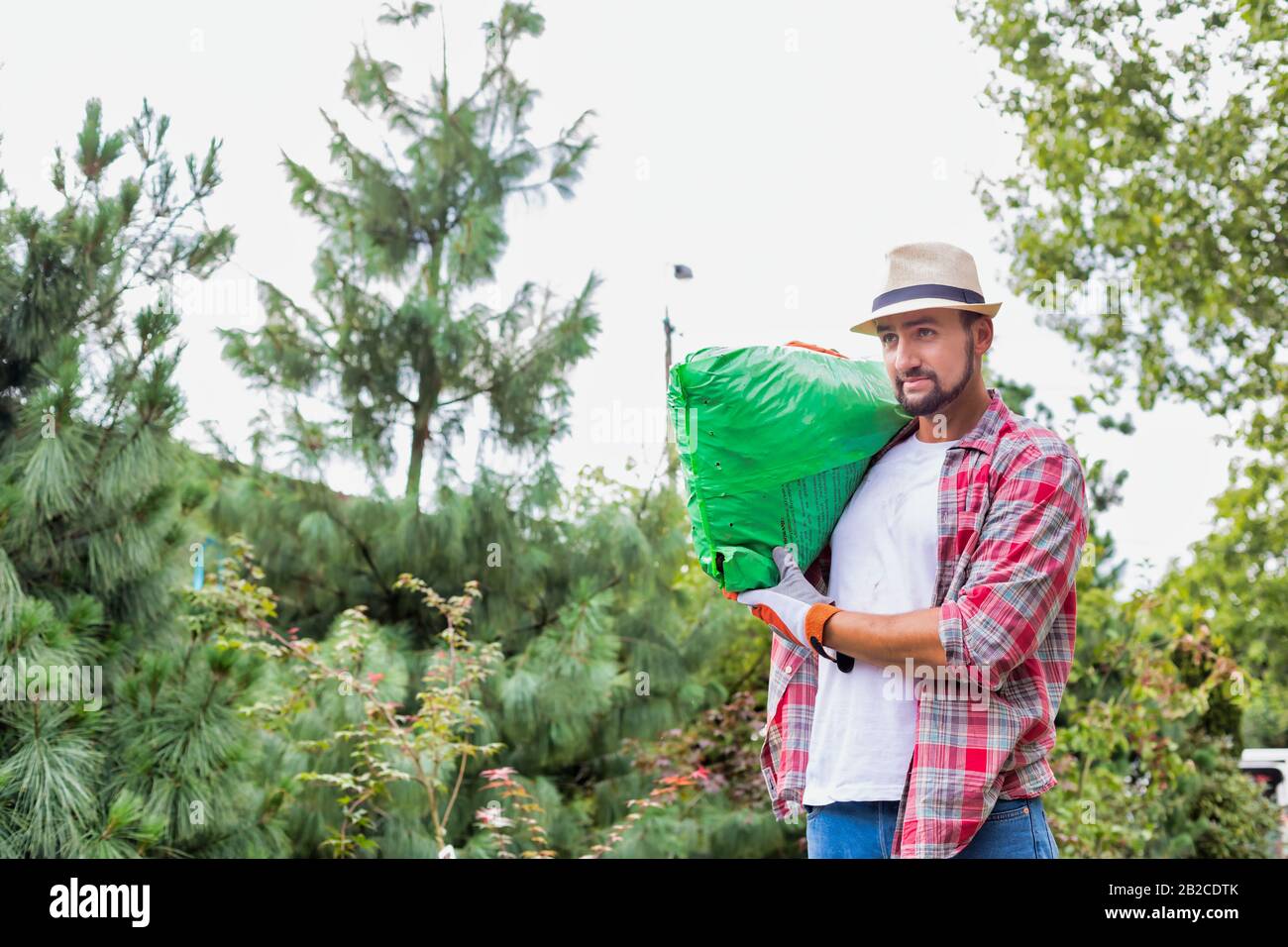 Man carrying sack on shoulder hi-res stock photography and images - Alamy