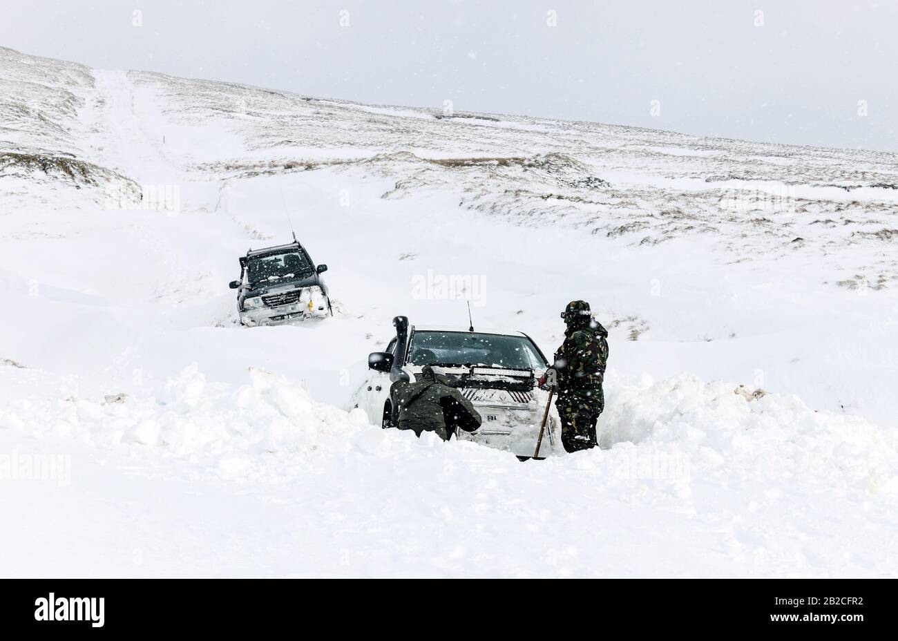 Teesdale, County Durham, UK. 2nd March 2020. UK Weather.  The 4x4 vehicles of those trapped in deep snow in Upper Teesdale have yet to be recovered.  The occupants spent the night in them during Storm Jorge and while they were rescued by Police, Mountain Rescue and a snow plough driver yesterday, their vehicles may take a while longer to recover.  Credit: David Forster/Alamy Live News Stock Photo