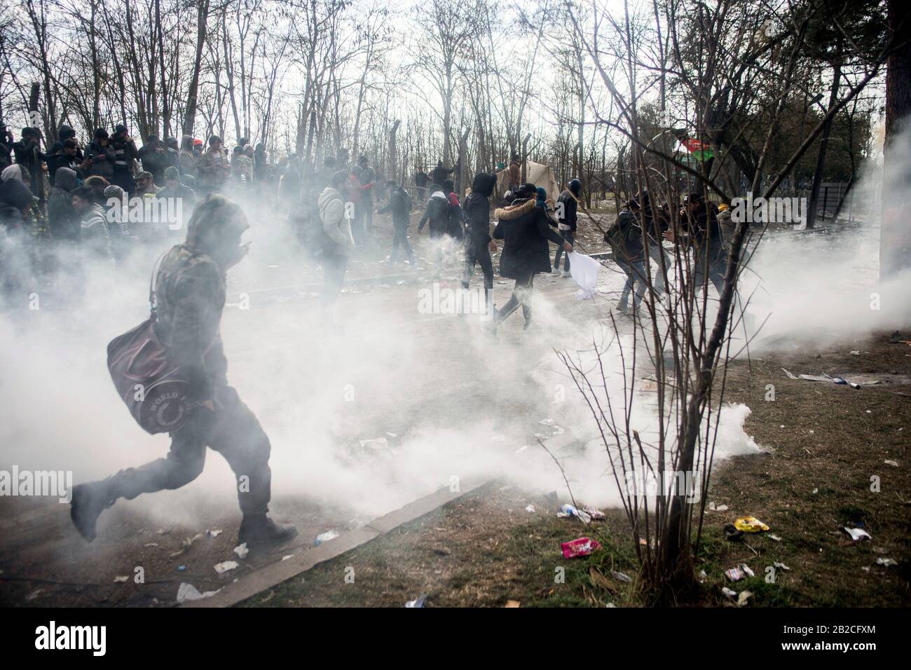 Istanbul. 2nd Mar, 2020. Illegal migrants are attacked by tear gas from Greek police at border zone in Edirne Province, Turkey, on March 1, 2020. TO GO WITH 'Greek police fire tear gas, rubber bullets against refugees at border zone in Turkey' Credit: Xinhua/Alamy Live News Stock Photo