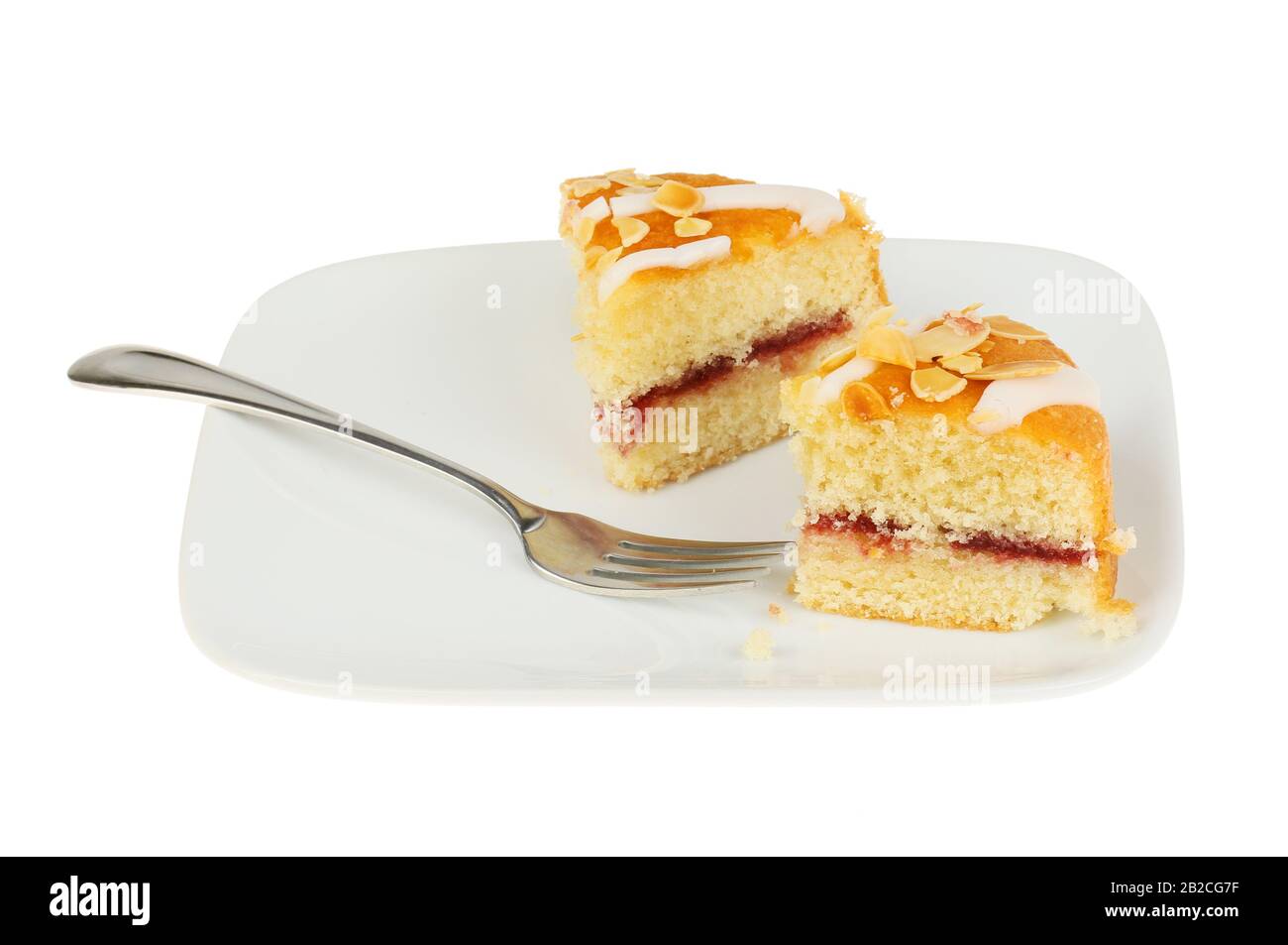 Bakewell cake with a fork on aplate isolated against white Stock Photo