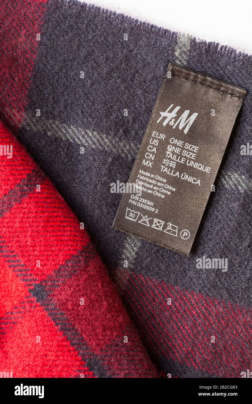 H&M one size label in tartan scarf made in China translated in different  languages - sold in the UK United Kingdom, Great Britain Stock Photo - Alamy
