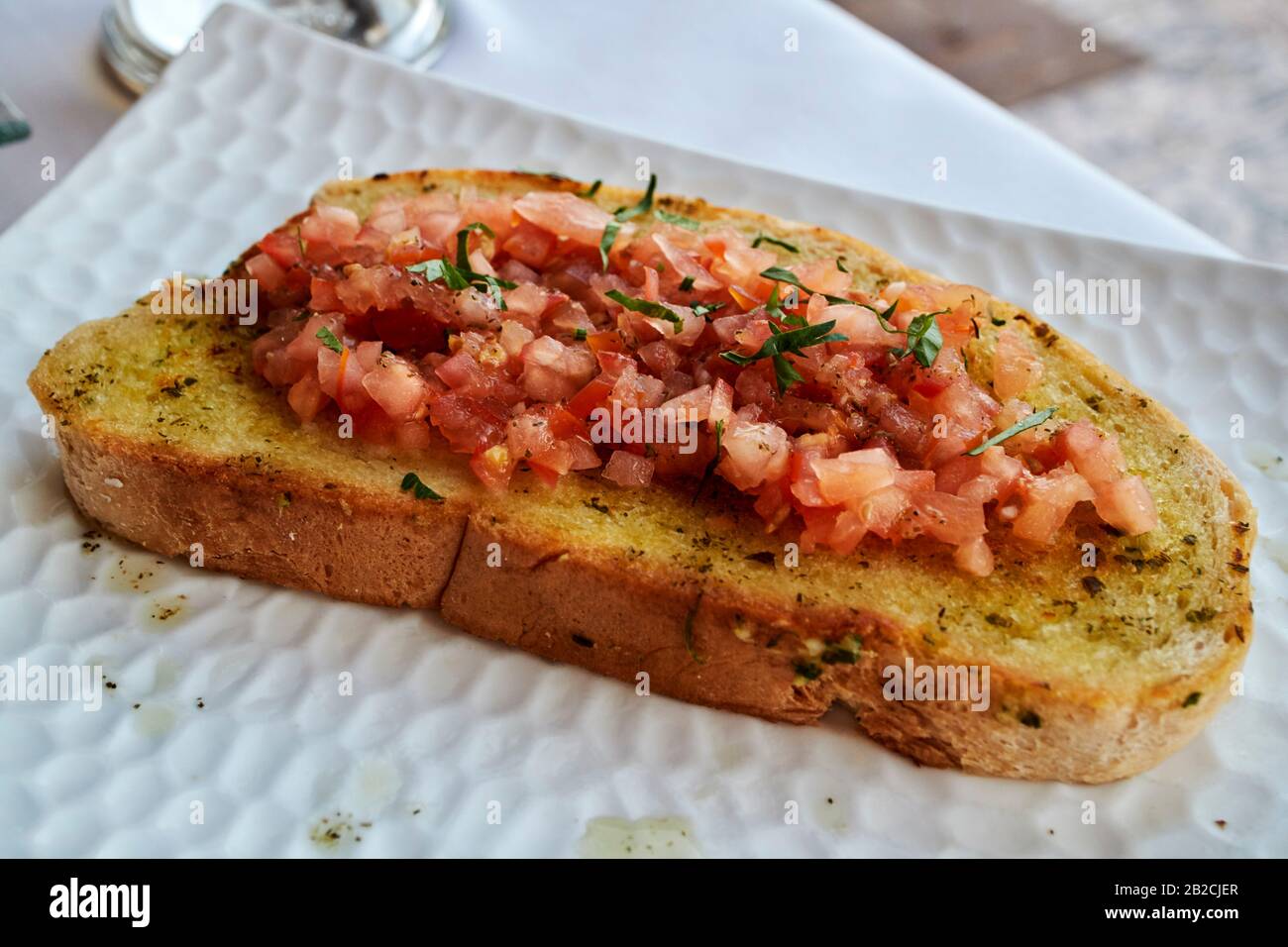 tomato bread served as a starter with tapas in spanish restaurant