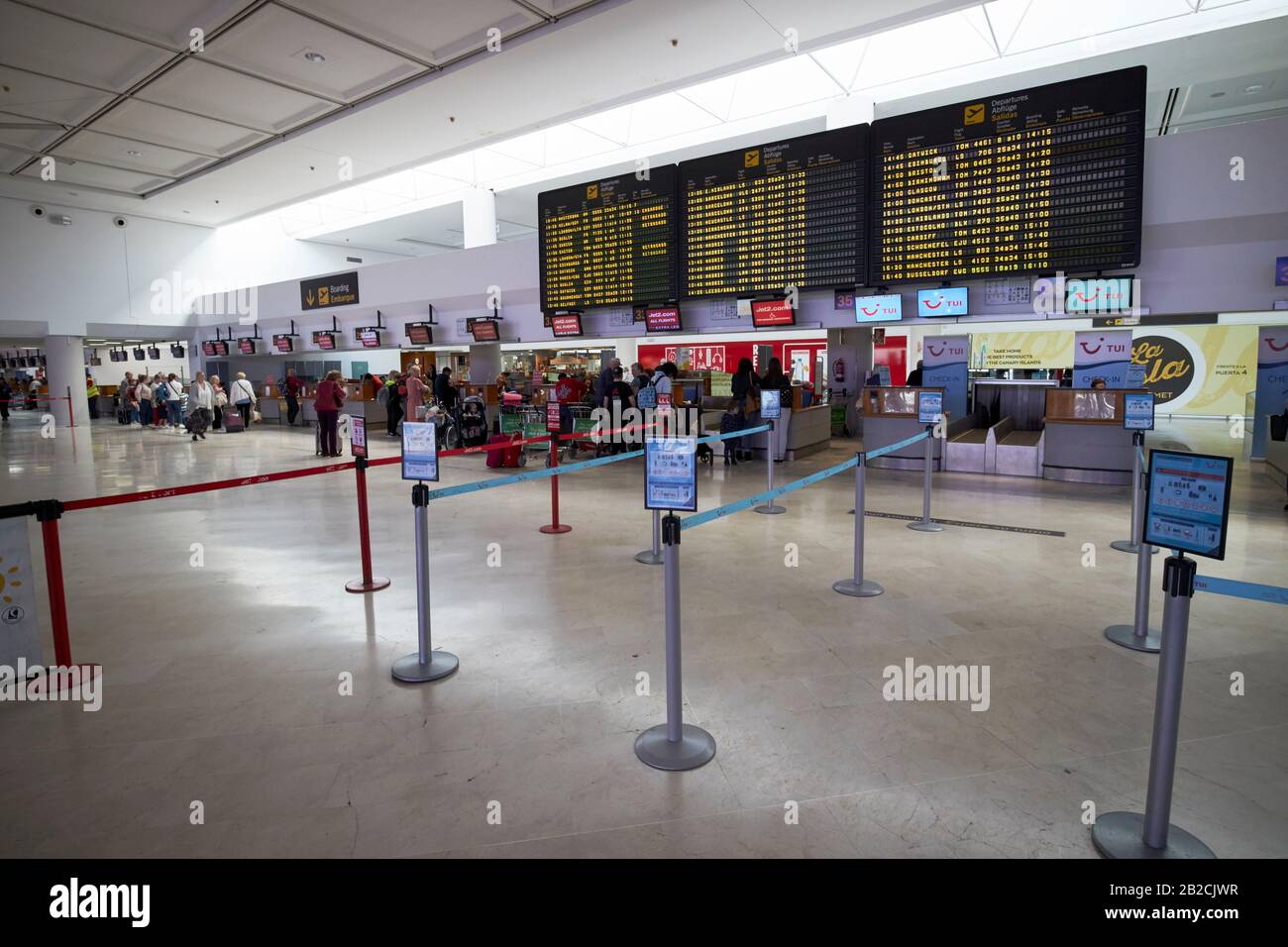 check in desks with departures board in terminal t1 arricife cesr manrique-Lanzarote airport canary islands spain Stock Photo