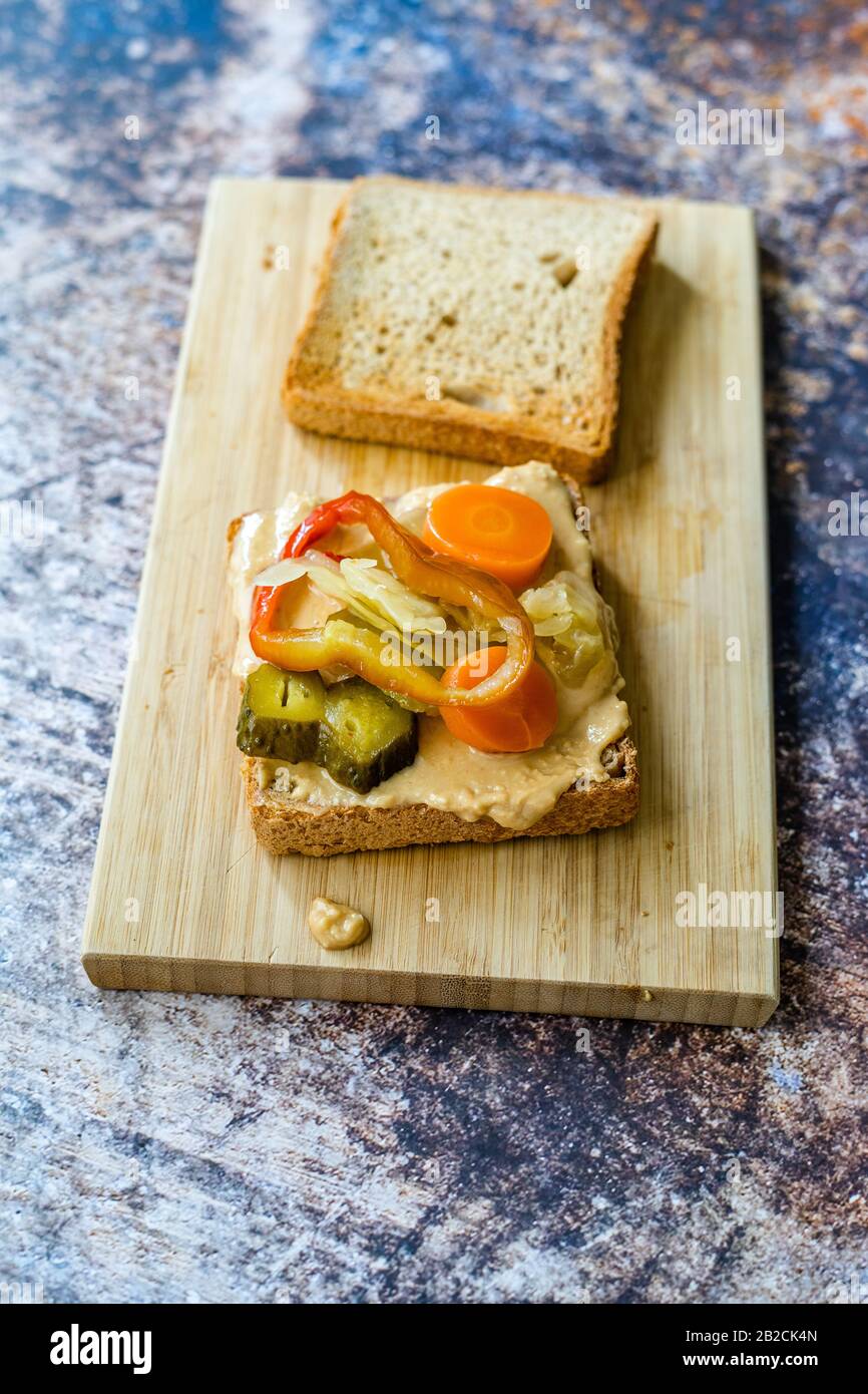 Organic Healthy Homemade Peanut Butter And Pickle Sandwich On Wooden Board Ready To Eat Stock Photo Alamy