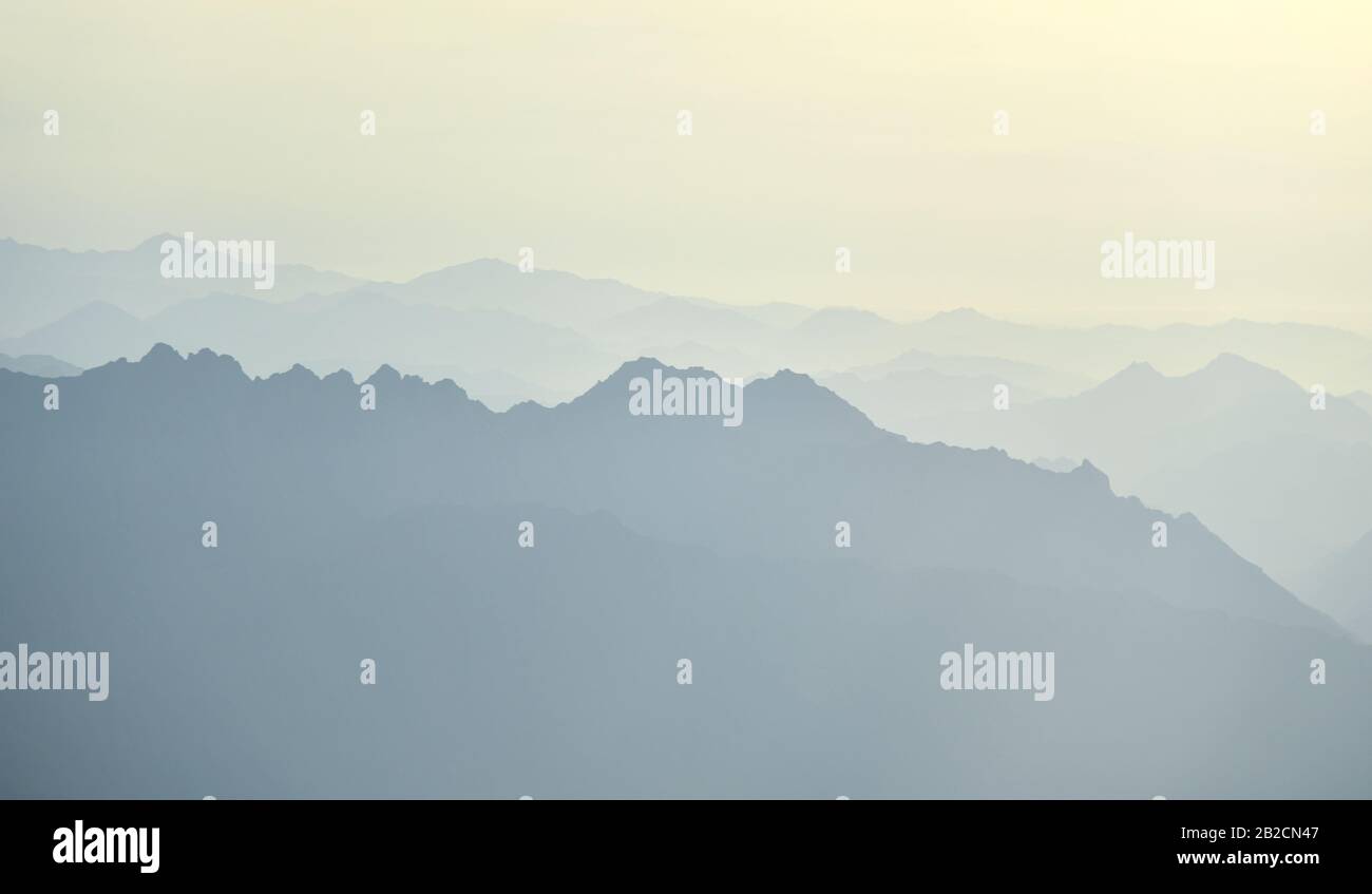 Desert mountains in the fog in the early morning. Stock Photo