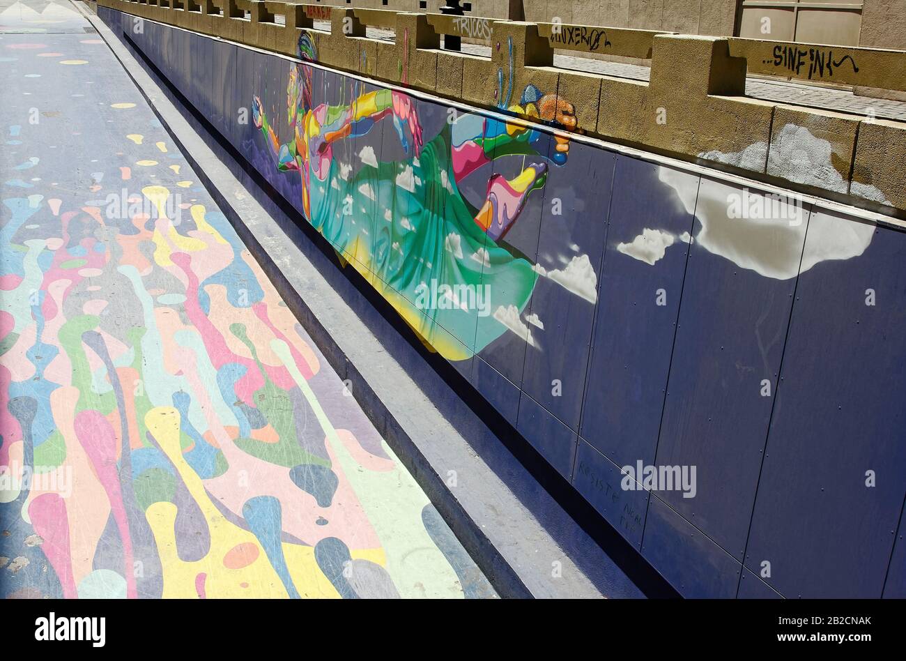 painting; street art; colorful, side of ramp, asphalt street; Paseo ...