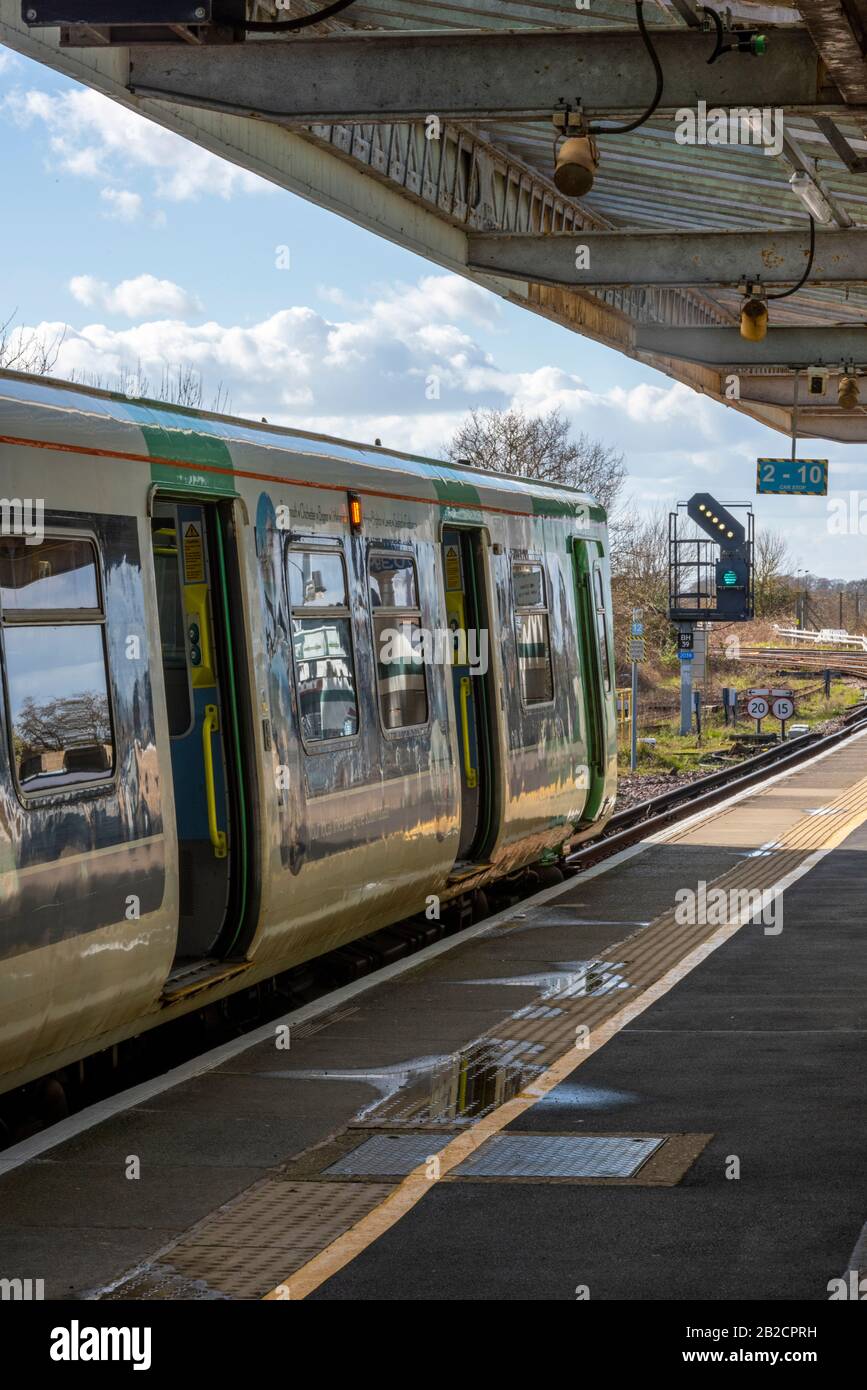 a class 313 electric multiple unit in the platform at Barnham station in west Sussex. Stock Photo