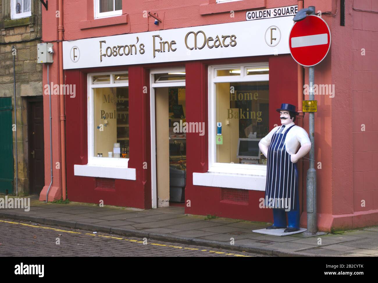 Model of a jolly butcher outside Foston's Fine Meats in Duns, Berwickshire, Scottish Borders, UK
