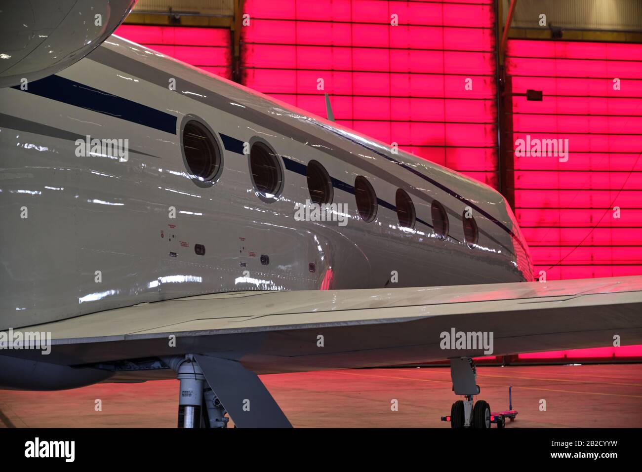 Pictured is a private aircraft in a hangar. Stock Photo