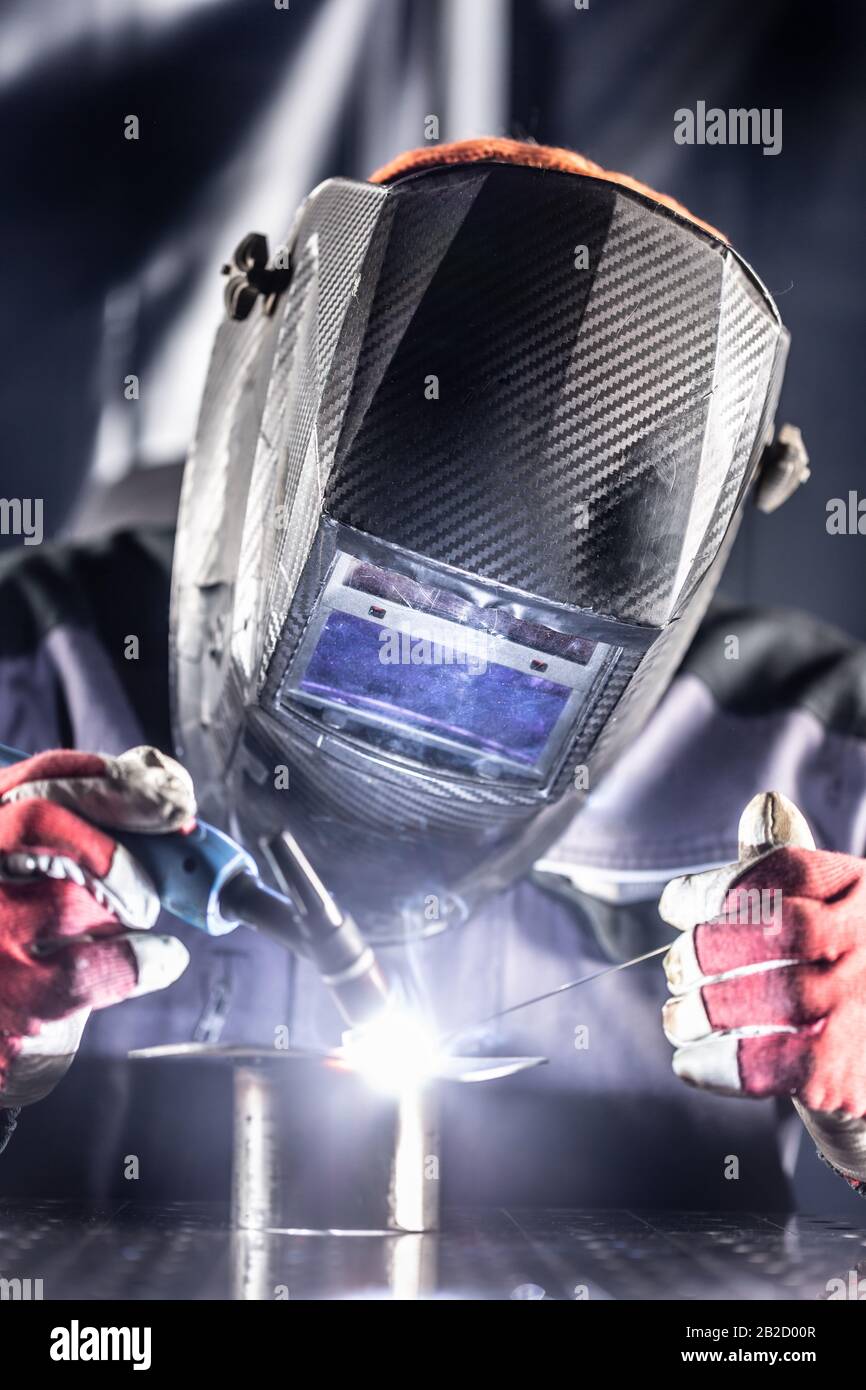 Welder industrial worker welding with argon machine Stock Photo Alamy