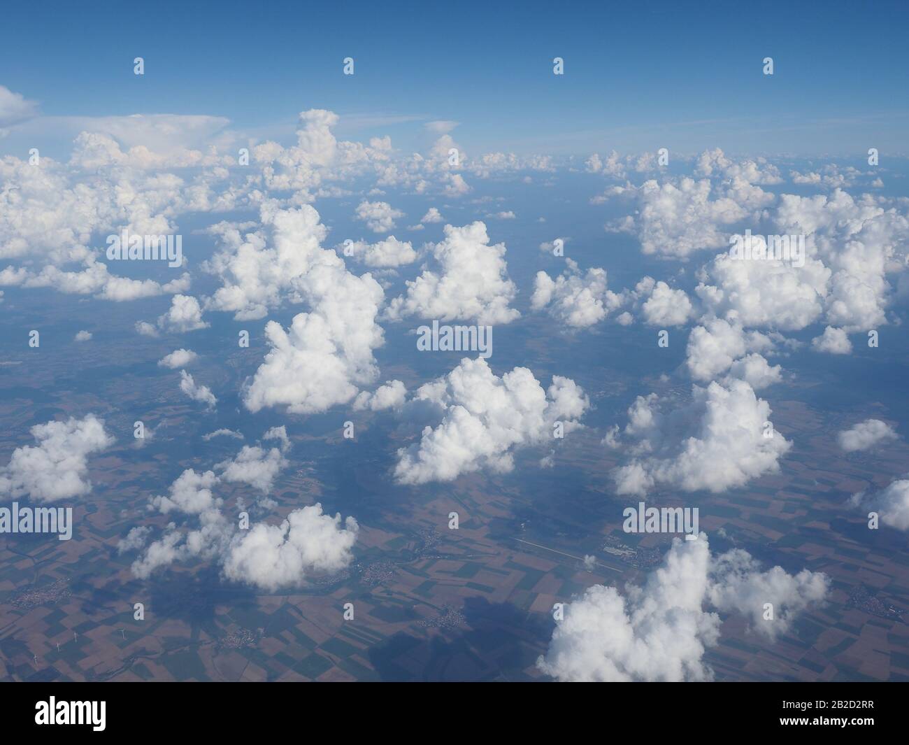 blue sky with clouds seen from plane useful as a background Stock Photo ...