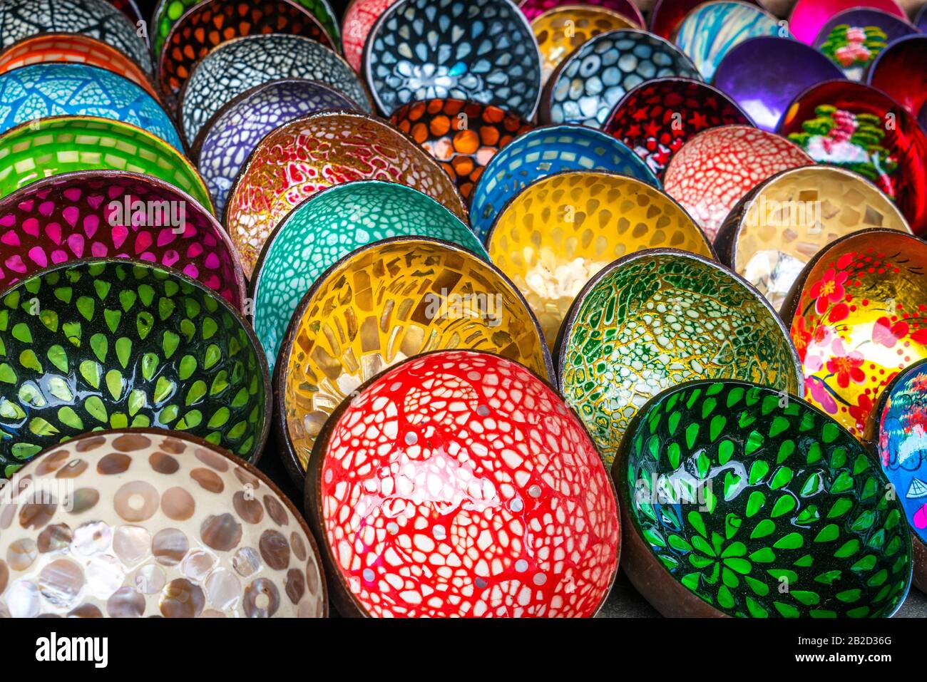 Hand crafted lacquer painted traditional Vietnamese bowls, made from coconut shells, for sale in