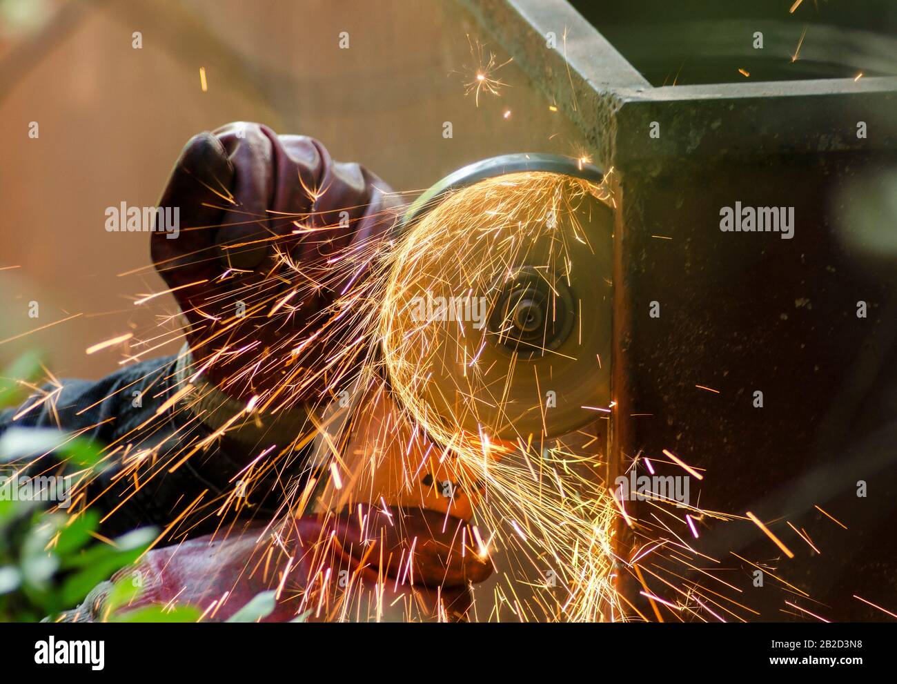 Metal cutting. Metal cutting with angle grinder. Man cuts metal for