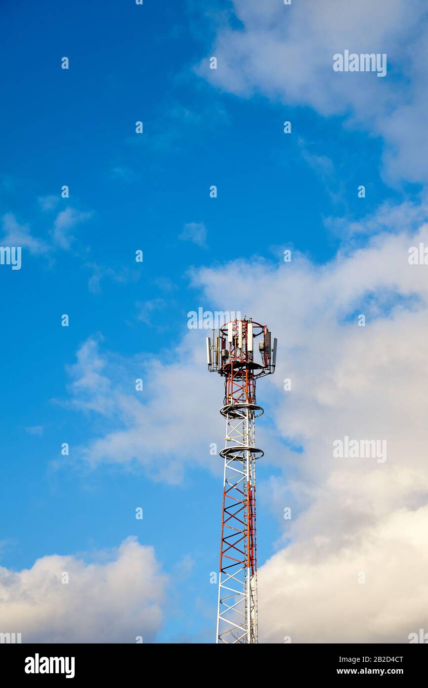 Telecommunication tower with antennas against the sky. Stock Photo