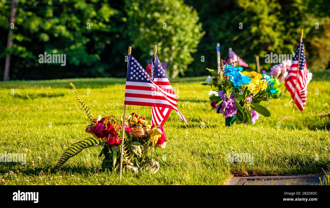 US Flags and Flowers presented at local cemetery on Memorial Day Stock ...